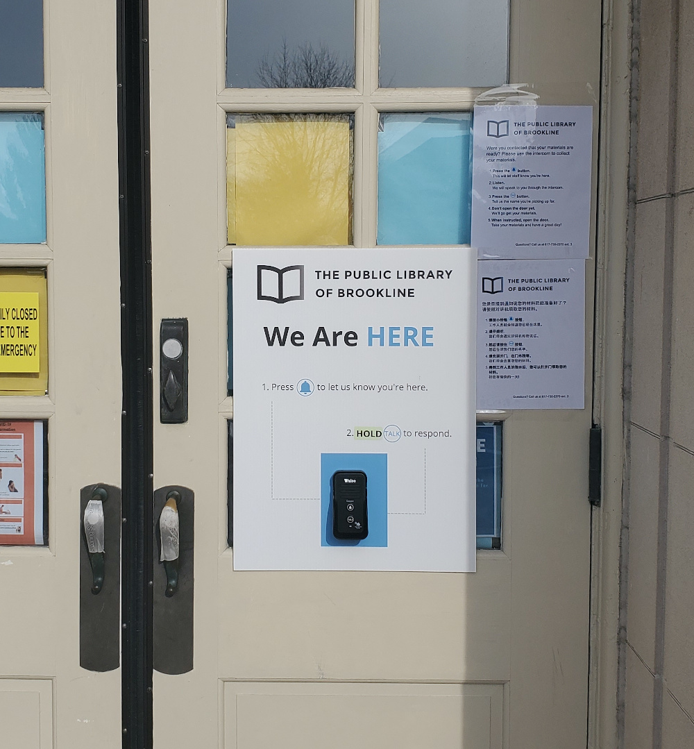 A wireless intercom is attached to the door of the library. Press the Bell button (the top button) to announce your presence to staff, and then hold the TALK button (the bottom button) to tell them your name.