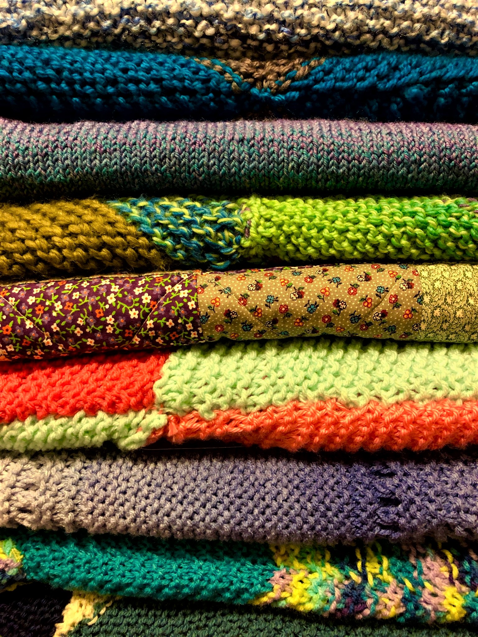 stack of handmade blankets