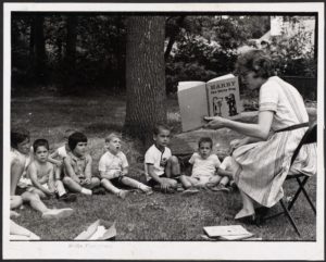 Reading to children at Soule Playground