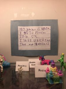 Card that says "My name is Maya. I go to Pierce. I am six. I love unicorns. They are magical!"