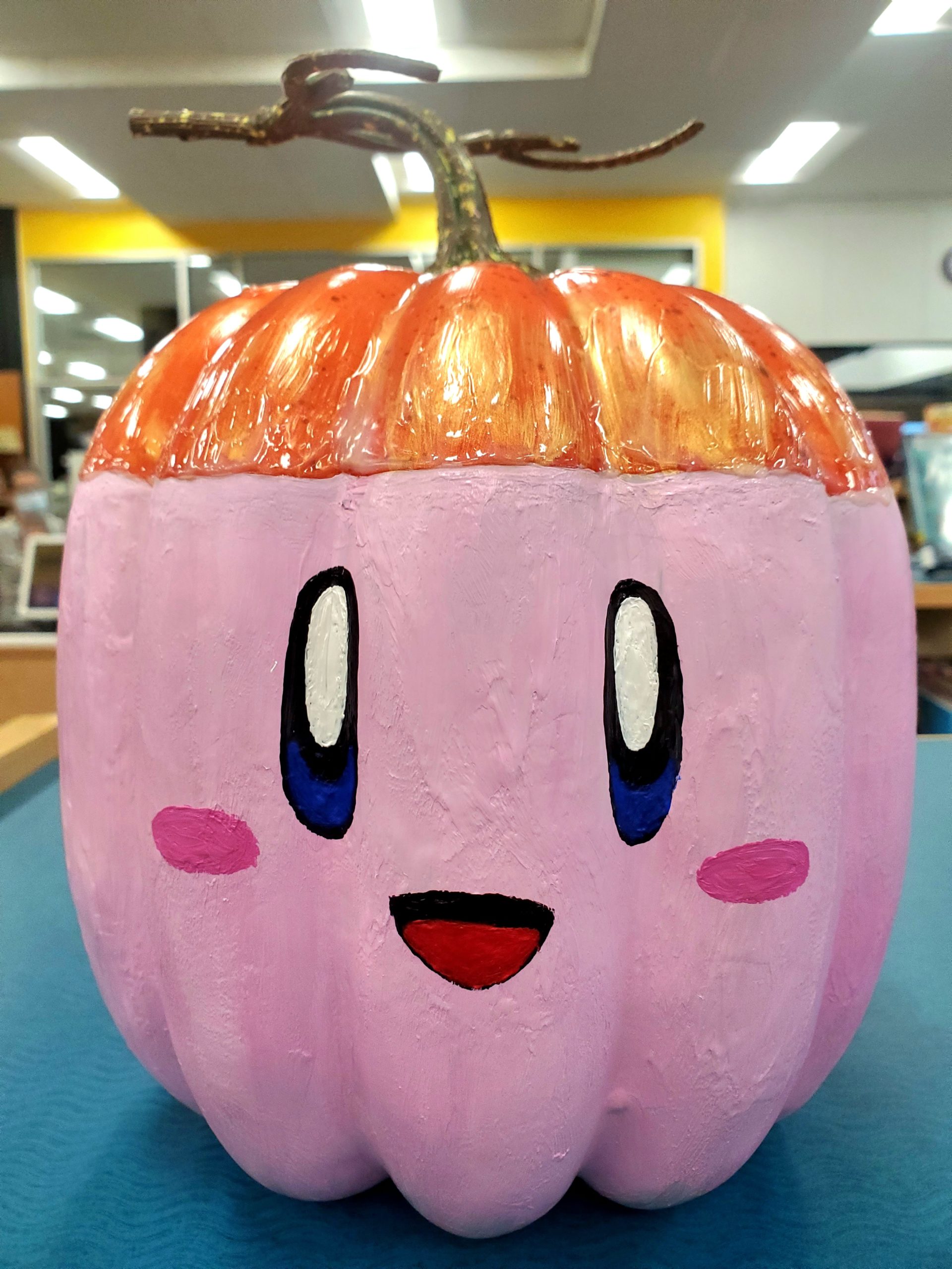 A pumpkin painted pink to look like Kirby