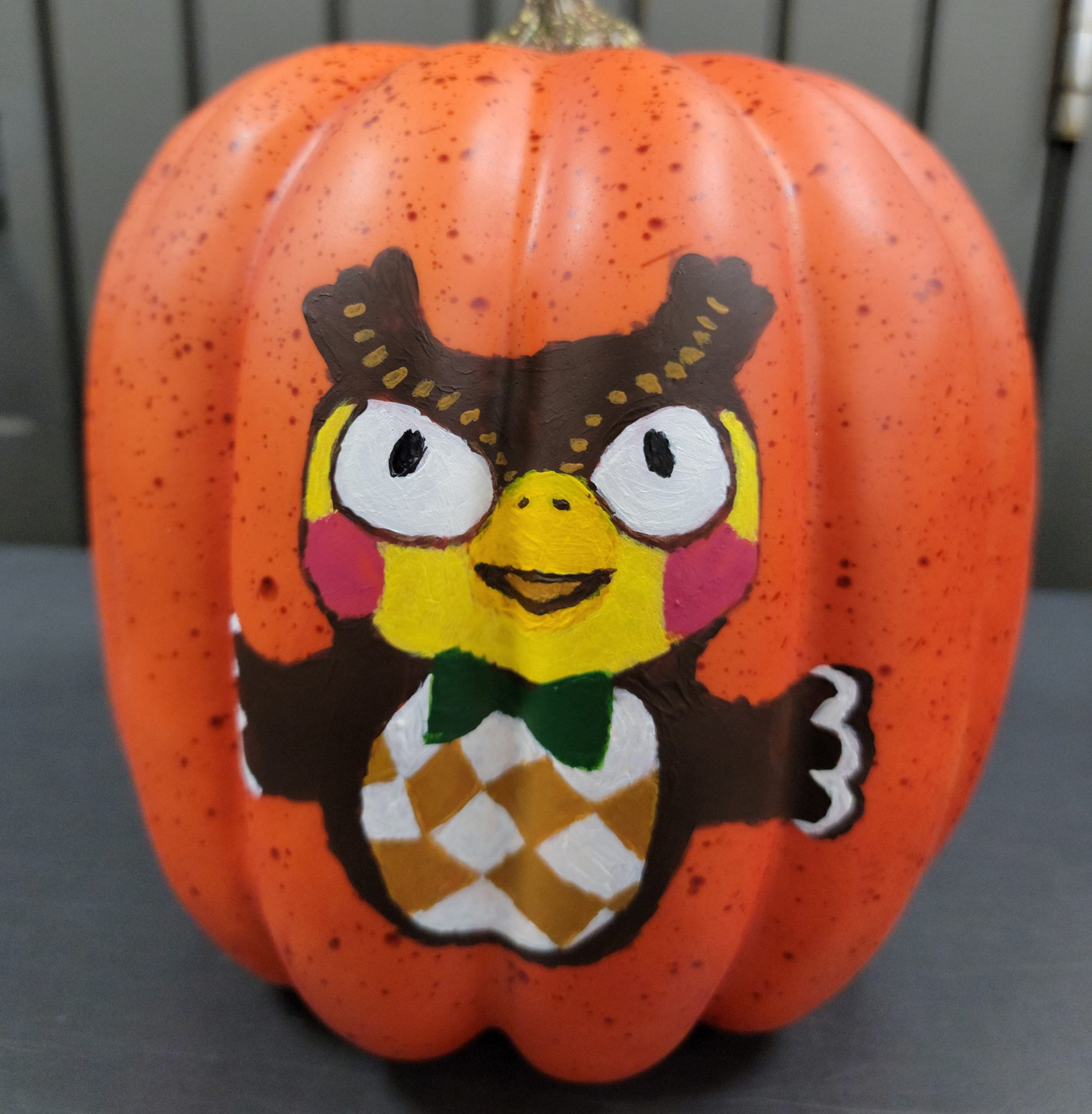 A pumpkin painted with Blathers from Animal Crossing
