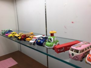 A display case of toy cars