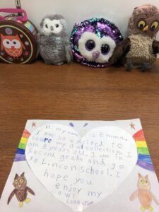 Collection of stuffed animal owls and a handwritten note of introduction