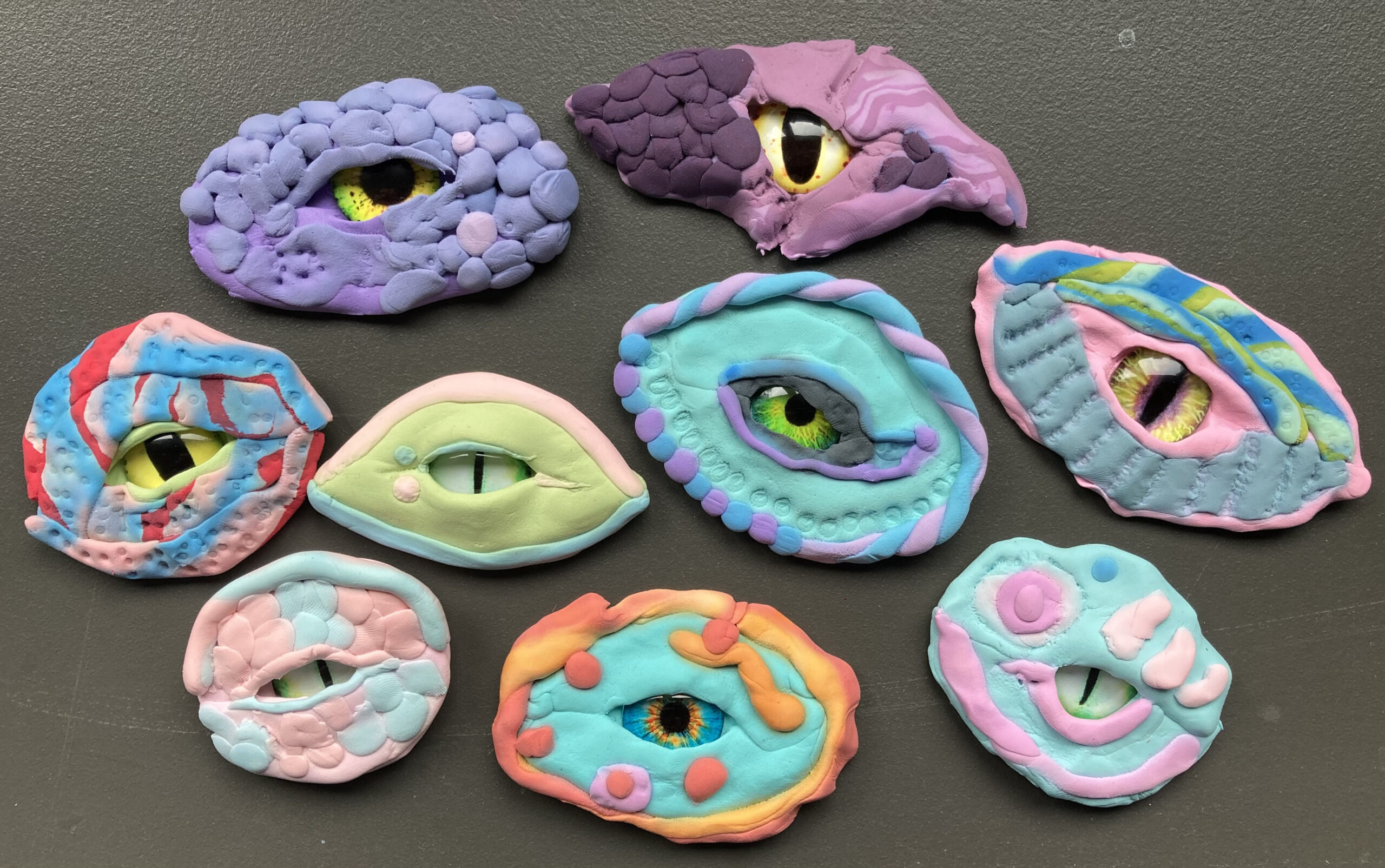9 colorful eye-shaped sculptures