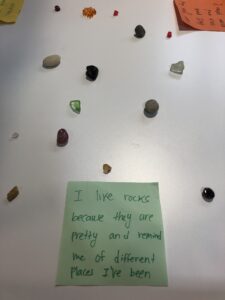 Rock collection with a hand-written note that says "I like rocks because they are pretty and remind me of different places I've been."
