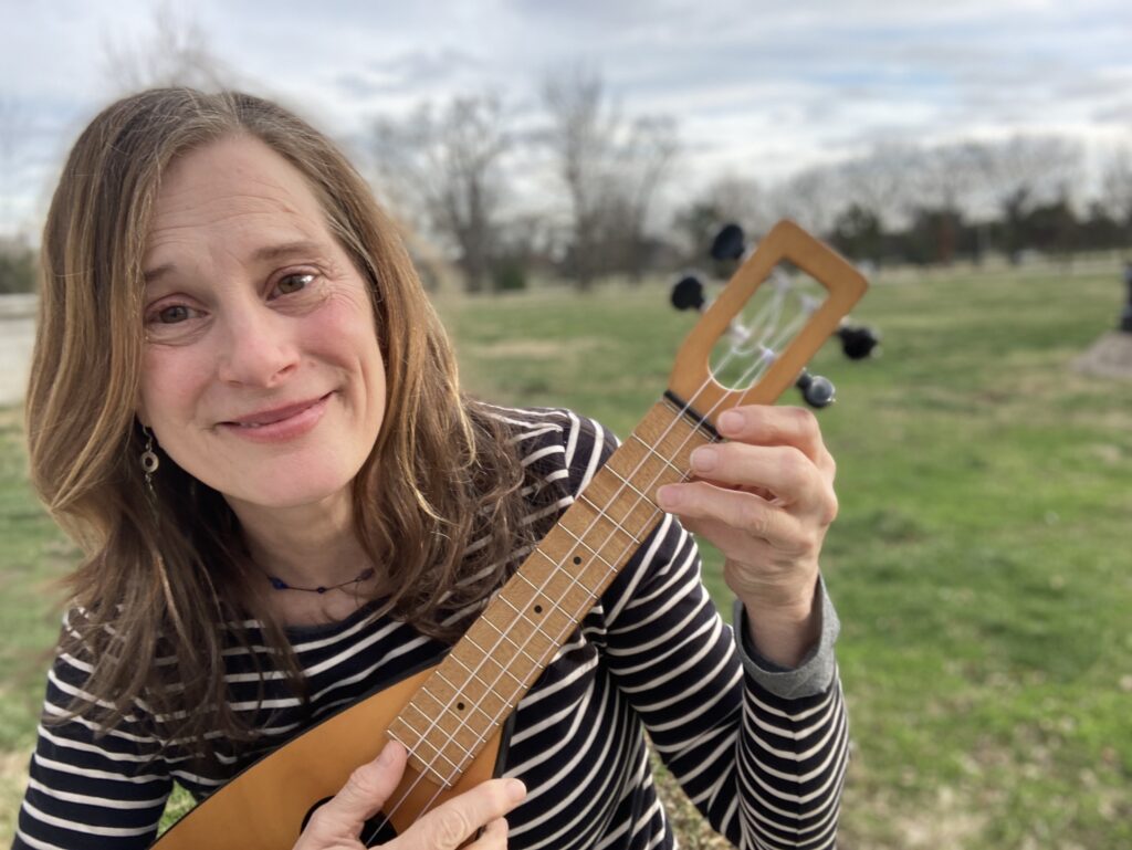 Julie Stepanek holding a ukulele
