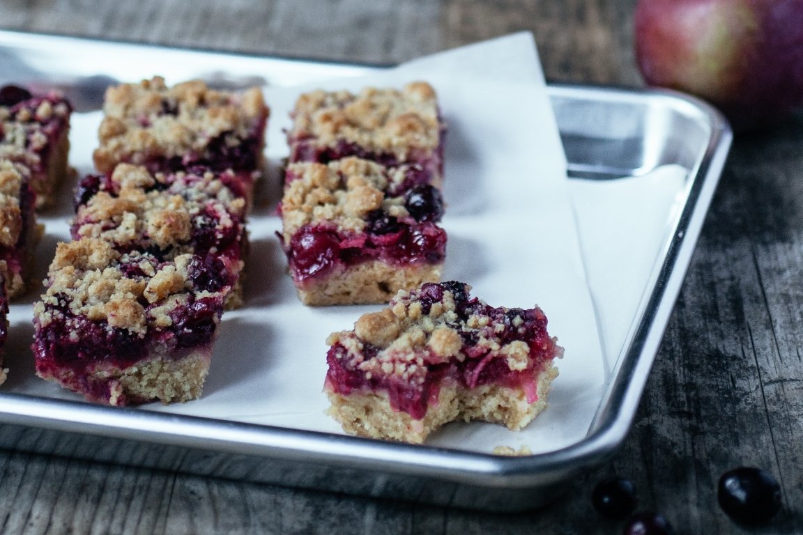 A photo of cranberry bars on a baking sheet.