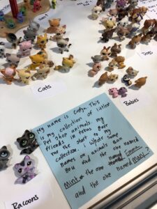 A collection of Littlest Pet Shop animal toys and a hand-written statement about the collection