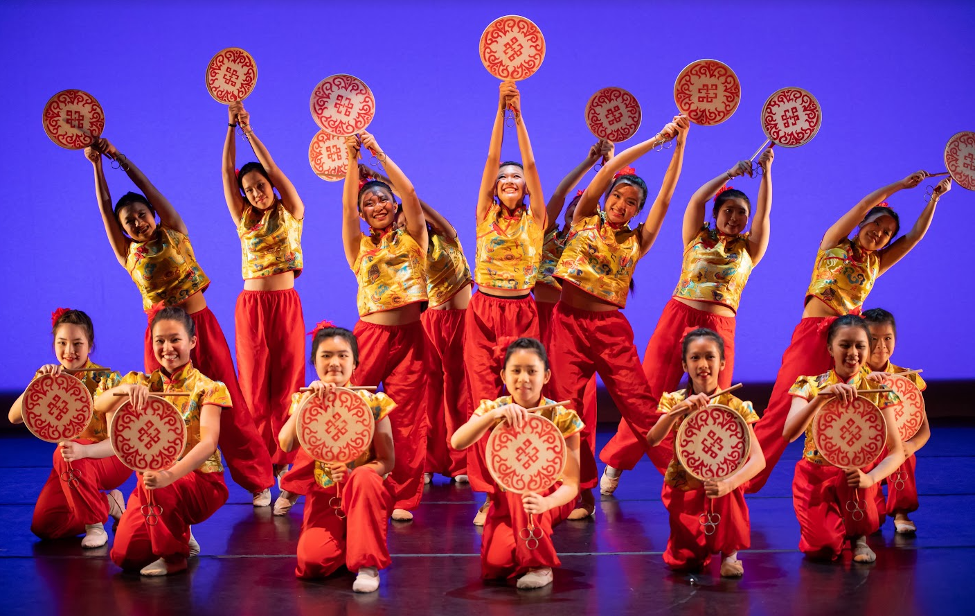 westwood chinese school dance troupe group photo, 12 young girls in red and yellow traditional costumes