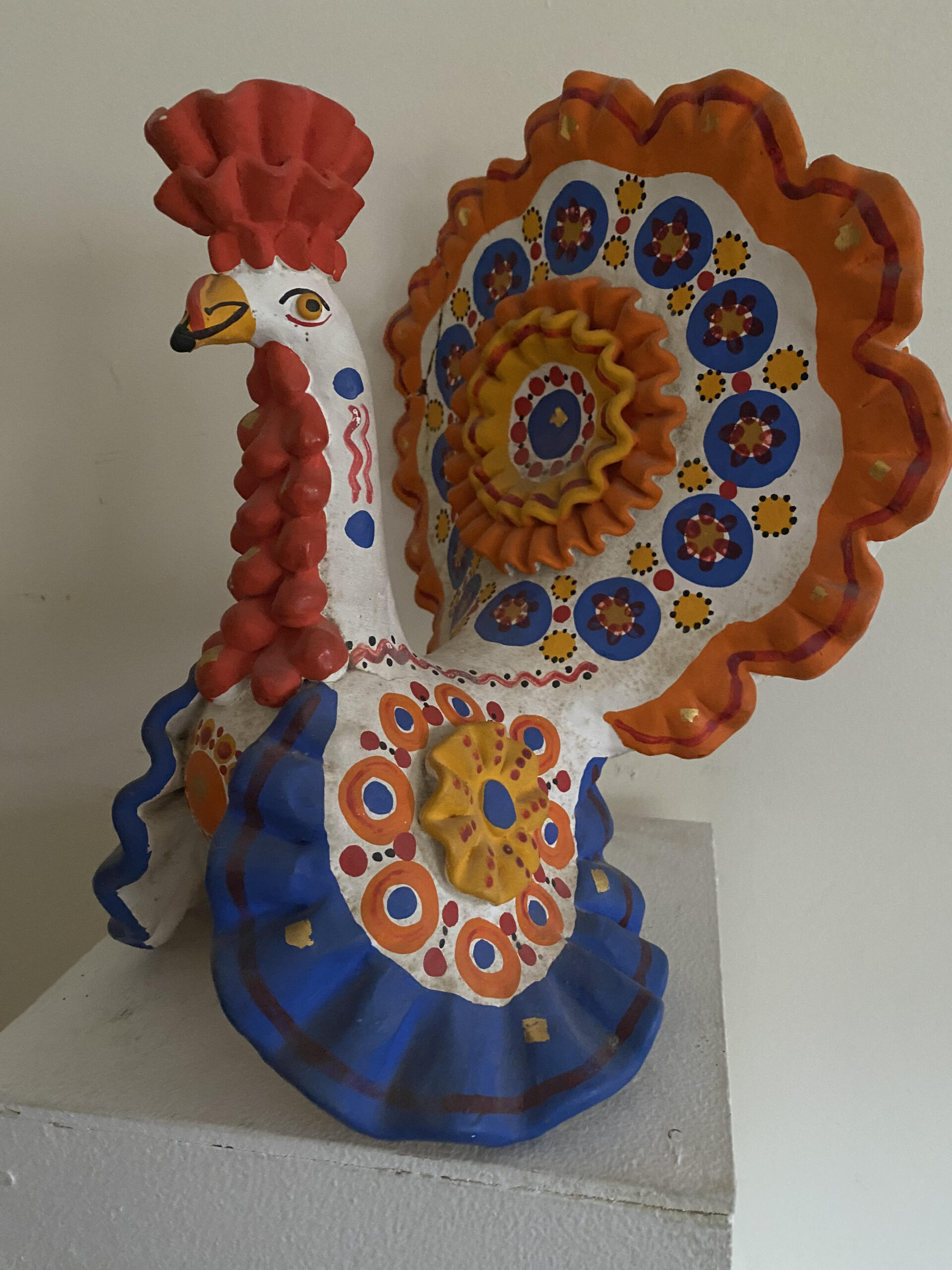 Folk art figurine in the form of a rooster.