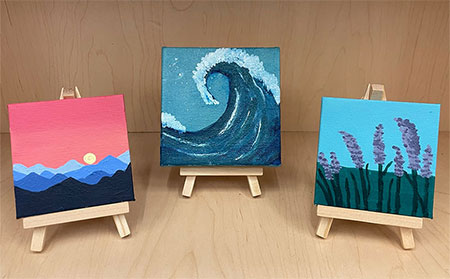 Miniature landscape paintings on easels