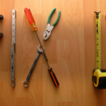 Tools spread out on a wooden counter.